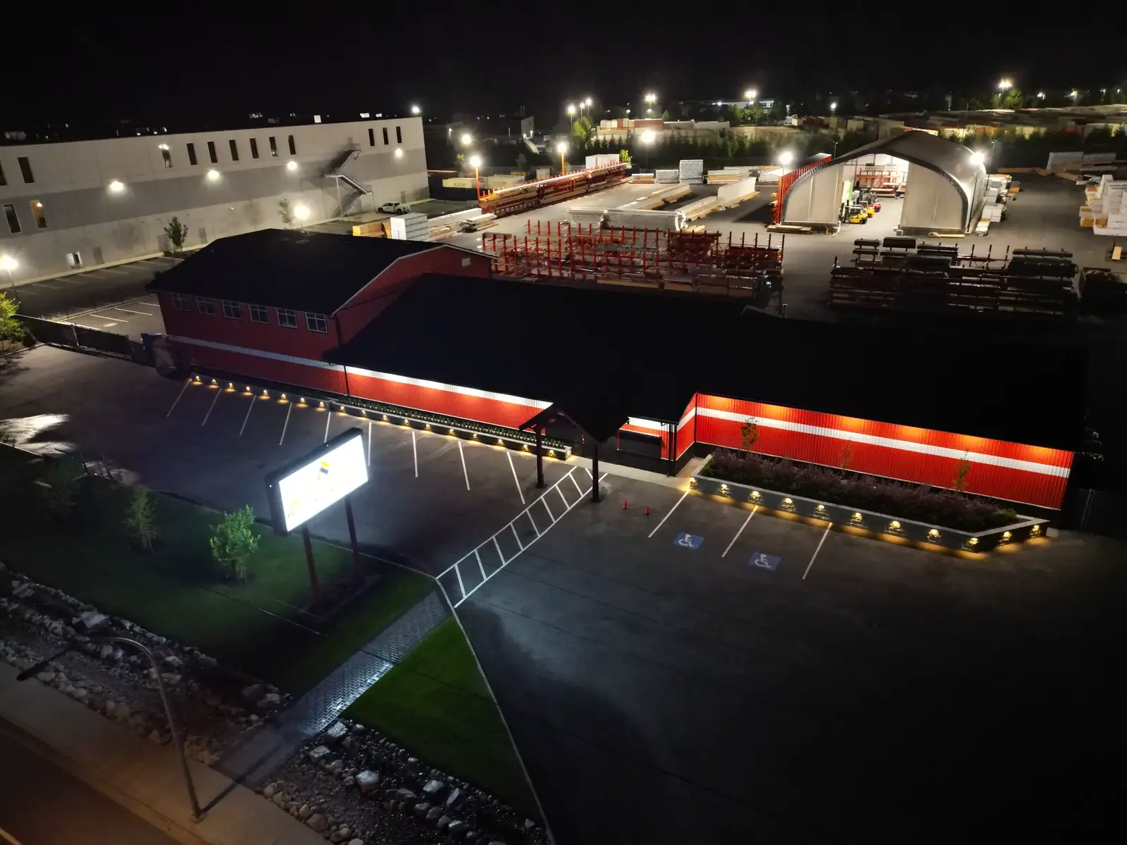 Aerial night view of the North Coast commercial site with illuminated raised planters