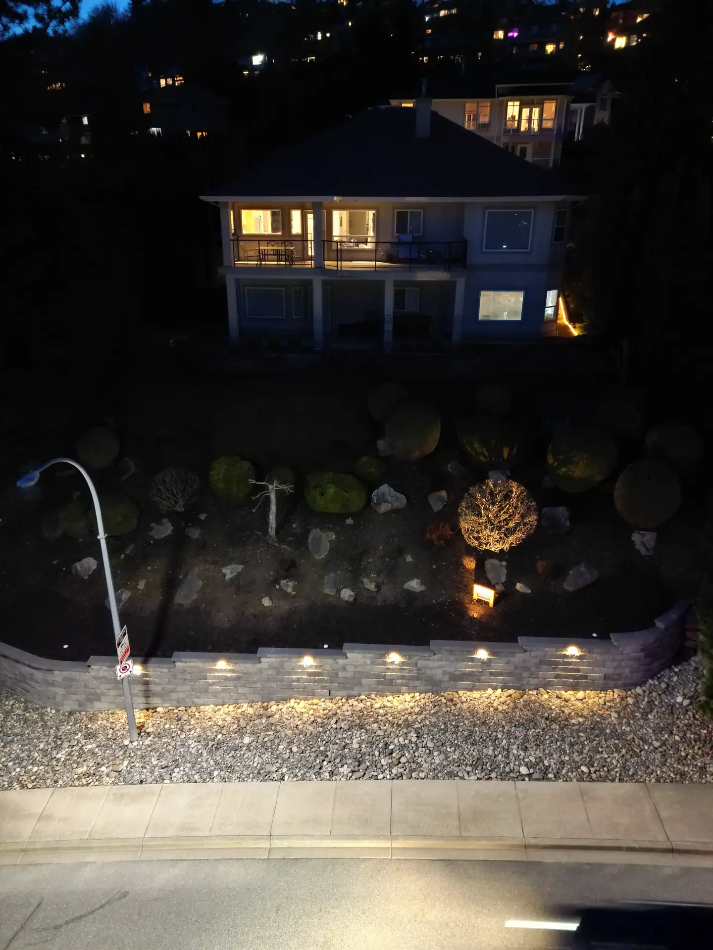 Retaining wall with integrated lighting at night in Mission